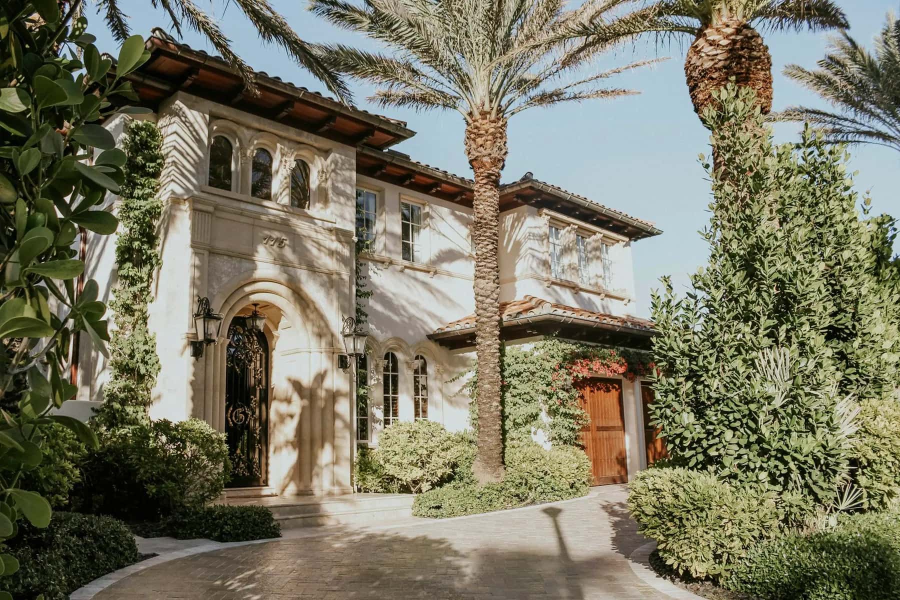 Mediterranean-style home with a paver driveway