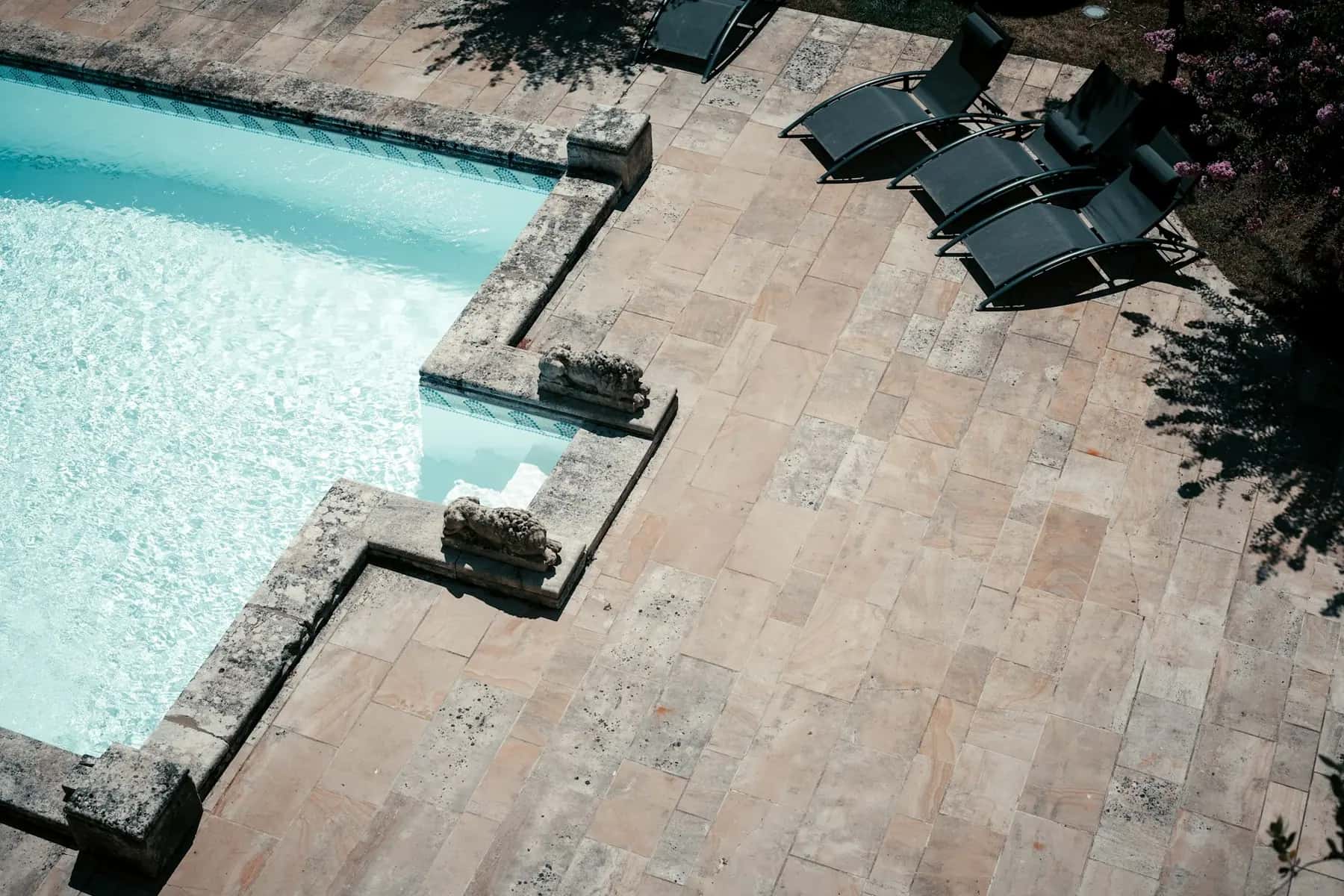 Aerial view of a tumbled travertine pool deck