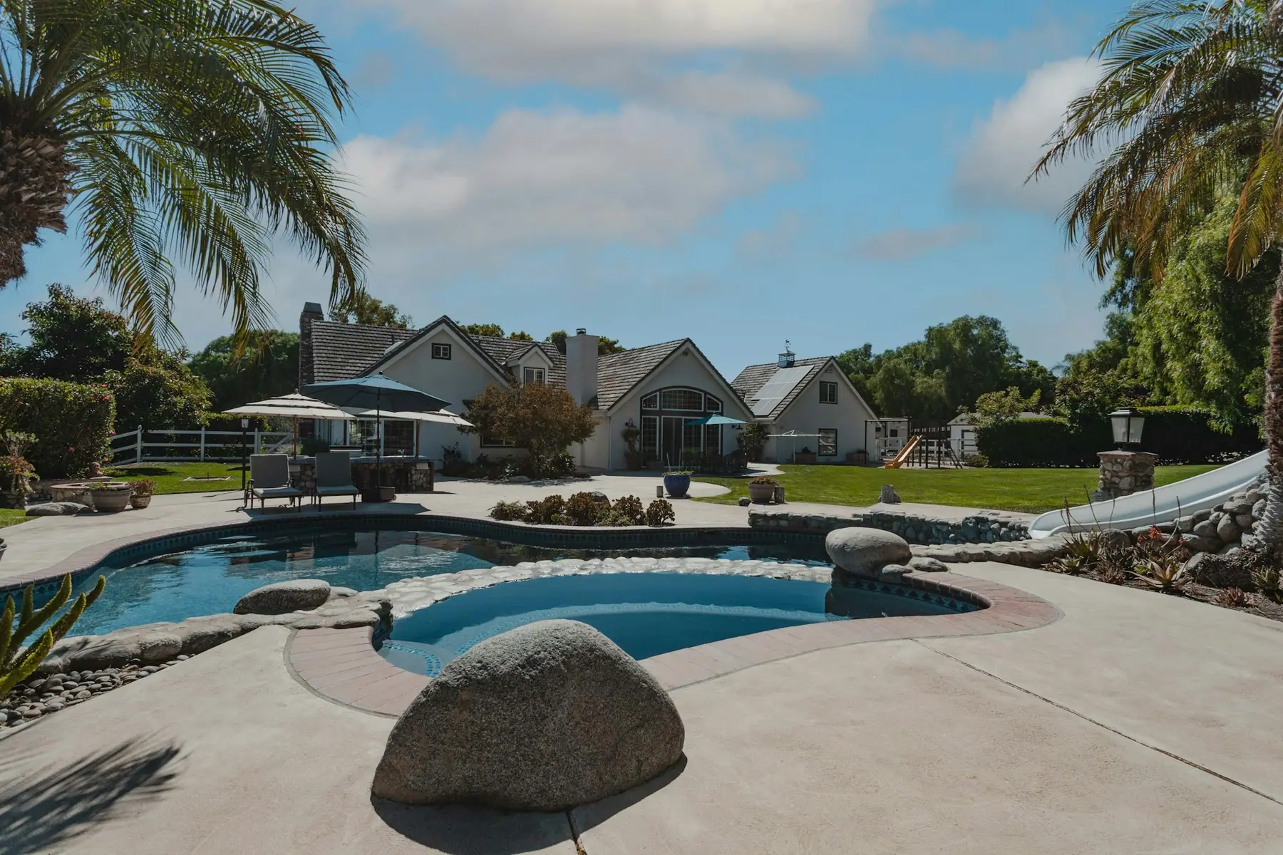 Before: pool surrounded by plain, worn concrete